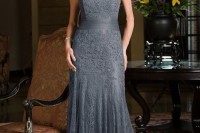 a grey fitting lace dress with a high neckline, cap sleeves, plus a sash and embellishments