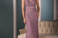 a pink lace maxi dress with thick straps and no sleeves, a V-neckline and a sash is a feminine option