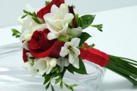 a refined contrasting wedding bouquet of greenery, burgundy roses and white freesias is a lovely idea for any wedding with red and white