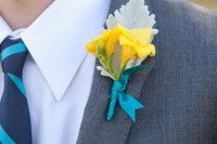 a cute yellow groom’s boutonniere