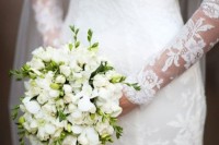 a white freesia wedding bouquet with a bit of greenery is a cool idea for a neutral wedding