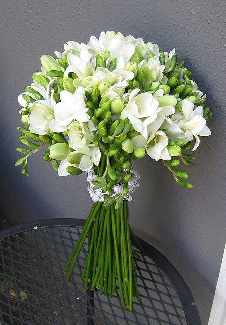 a white freesia wedding bouquet with greenery is a lovely idea for a neutral wedding, it's pretty and cool
