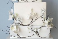 a simple square wedding cake with flowers