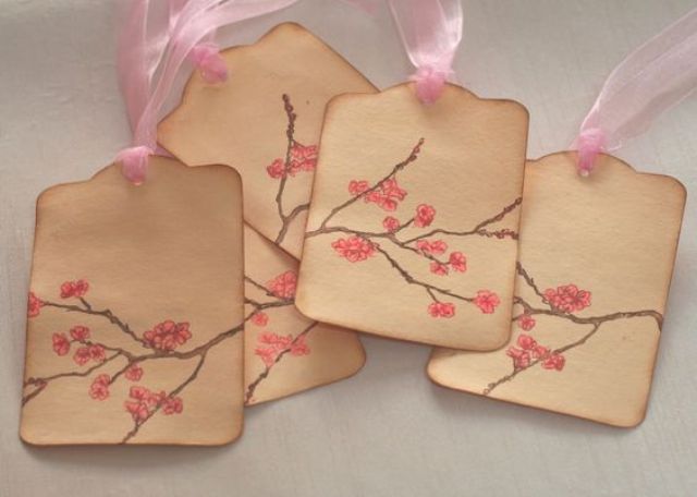 cherry blossom tags can personalize your wedding favors or can be hung on the centerpieces to make the table number