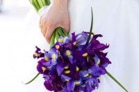 a bold blue iris wedding bouquet with greenery is a colorful touch to your wedding look