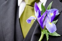 a pretty blue iris wedding boutonniere with some greenery is a chic idea for a modern and bold wedding