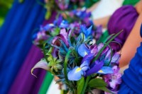 a bold blue iris wedding bouquet with some greenery is a great addition of color to your bridesmaids’ looks