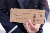 escort cards styled as plane tickets of cardboard for a travel-themed wedding