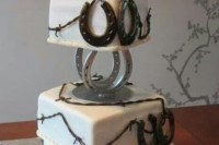 a farmer’s wedding cake with lots of edible horseshoes and a creative wedding cake topper with a tractor