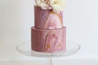 a beautiful pink marble wedding cake topped with fresh neutral blooms is a refined solution for a modern pastel wedding