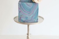 a bright square marble wedding cake with a single neutral bloom is a gorgeous idea for a bold wedding