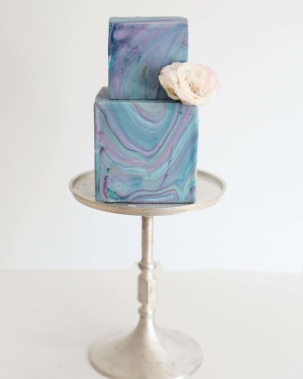 a bright square marble wedding cake with a single neutral bloom is a gorgeous idea for a bold wedding