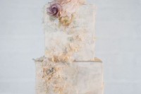a refined neutral marble wedding cake with sugar blooms and patterns is an ethereal and out of the box solution to rock