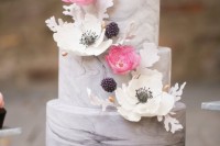 a grey marble wedding cake with fresh and sugar blooms, berries and sugar leaves is a beautiful solution for spring or summer