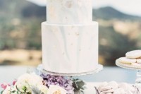 a blue marble wedding cake with gold and silver leaf is a fantastic idea for a beach or coastal wedding