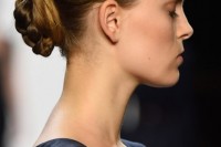a stylish low updo – a braided and twisted low bun with a bump on top is a timeless idea for a bride