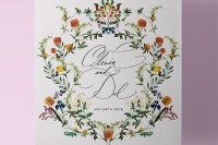 a colorful floral wedding invitation suite with greenery and bold blooms and lovely calligraphy is a very chic and bold idea