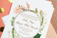 a delicate and classic wedding invitation suite with pink and neutral floral prints and greenery plus gold touches
