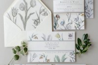 a pretty floral wedding invitation suite with flowers and leaves drawn with pencils is a very creative and fresh idea