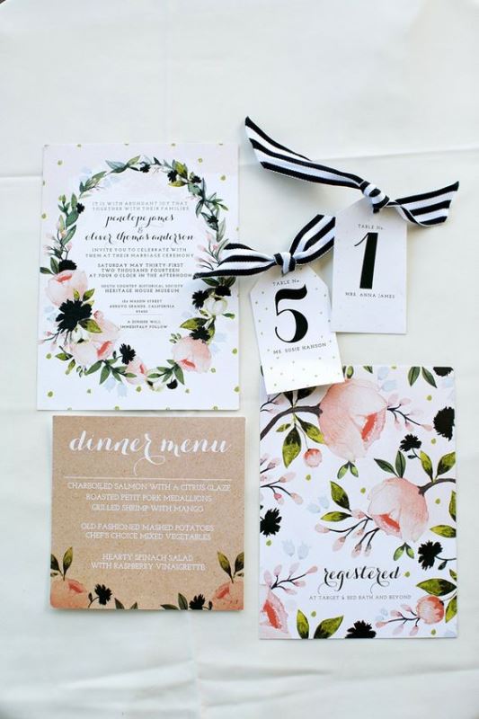 a bright floral wedding invitation suite with blooms and a wreath printed plus a kraft paper menu for a summer wedding