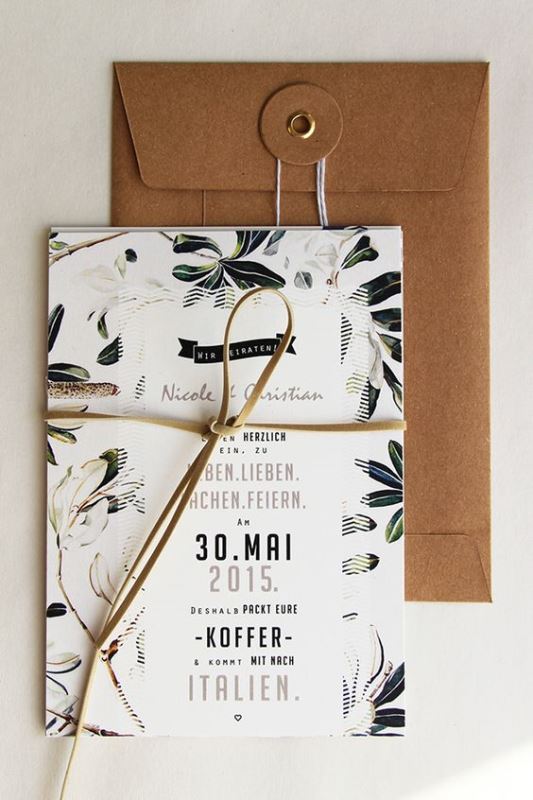 a cool botanical wedding invitation with botanical and floral prints, with leather cord and a kraft paper envelope is a cool idea
