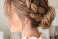 a French braid low bun with some locks down looks voluminous and very romantic