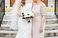 a blush maxi dress with sequined long sleeves and a high neckline for a glam feel