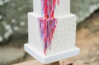 a bright square wedding cake with sugar macrame, bold watercolor, fresh blooms on top for a summer boho fest