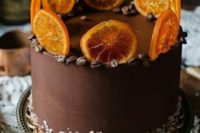 a chocolate and coffee wedding cake with sea salt and candied citrus slices is an alternative to a usual wedding cake
