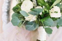 a cool neutral wedding bouquet composed of freesia, peony roses, astilbe and greenery is a gorgeous solution for a neutral wedding
