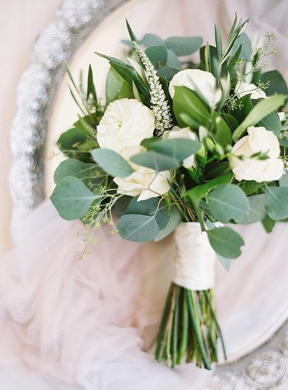 a cool neutral wedding bouquet composed of freesia, peony roses, astilbe and greenery is a gorgeous solution for a neutral wedding