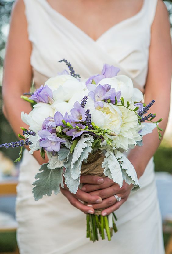 a delicate wedding bouquet of white peonies, lilac freesia, lavender and pale leaves is a cool idea for spring or summer