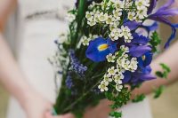 a gorgeous long stem wedding bouquet with waxflower, irises and greenery is a lovely and bold solution for a spring or summer wedding
