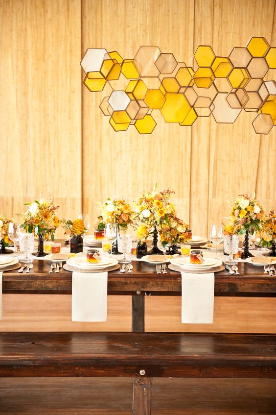 a lovely honeycomb wedding overhead installation of glass is a creative idea for a honey-themed wedding