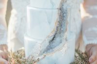 a marble and geode wedding cake with gold edge is a trendy and statement idea for a modern wedding