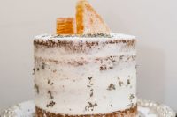 a naked wedding cake topped with honeycombs and lavender is a cool and delicious idea with natural aromas