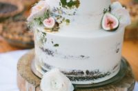 a naked wedding cake with gold leaf, figs, apples and pink blooms and air plants is a gorgeous idea