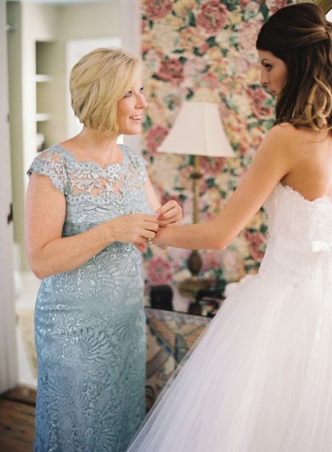 a powder blue fitting lace dress with cap sleeves and a touch of sparkle is very chic and refined