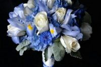 a pretty wedding bouquet with blue irises and white roses plus pale greenery is a lovely and chic idea for adding something blue