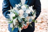 a pretty wedding bouquet with white and serenity blue blooms, berries, greenery is a very cool idea for a spring wedding