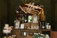 a refined vintage-inspired coffee bar with blooms, greenery, calligraphy, a naked wedding cake and lots of coffee machines