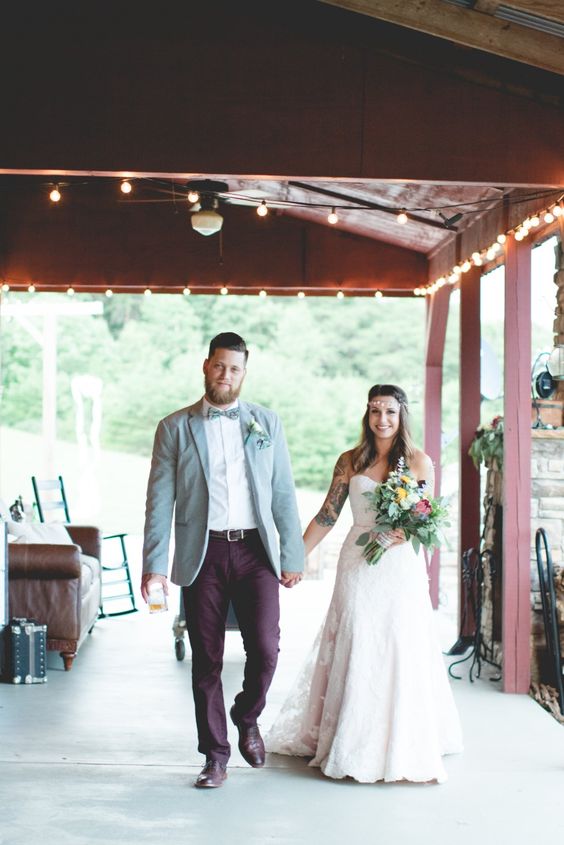 a stylish groom's outfit with a light blue blazer, a white button down, burgundy pants, brown shoes