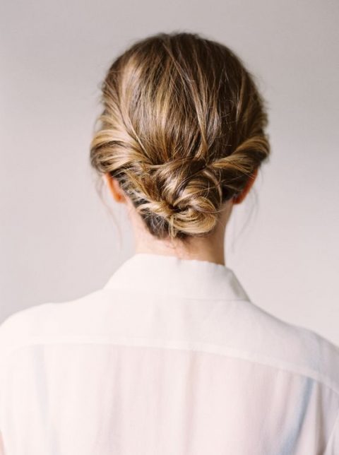 a twisted low bun with a textural top is long lasting lob styling for a bride or bridesmaid