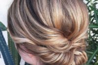 a twisted low updo with a sleek bump is an elegant and chic hairstyle for a bride or bridesmaid