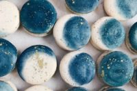 blue and neutral moon phase cookies with gold leaf on top are chic and cool desserts