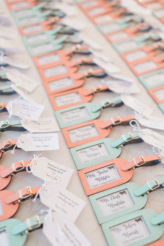 pastel-colored luggage tags are nice wedding favors and can also double as escort cards, too