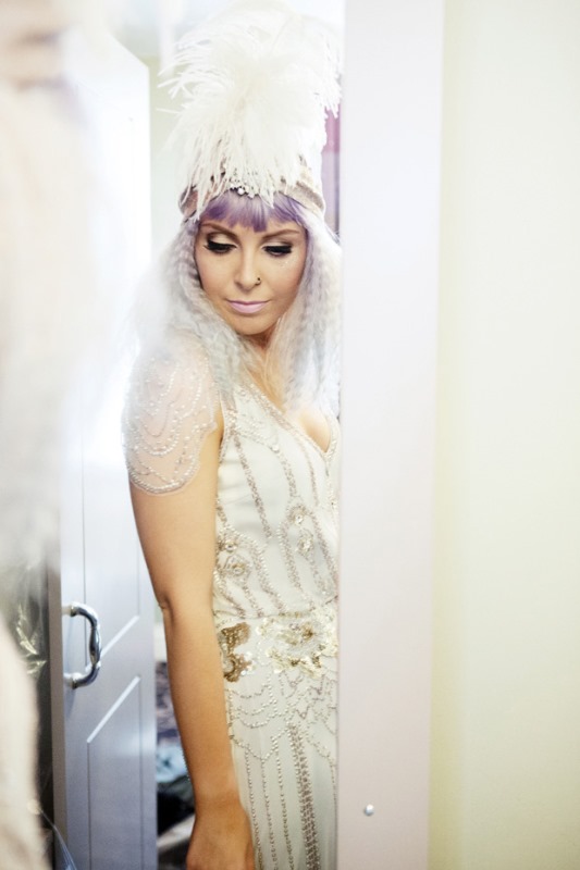ombre purple hair with waves, a statement feather headpiece and a nose piercing will make the art deco bridal look very special