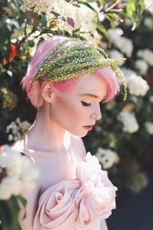 bright pink hair in a simple updo with greenery plus a blush wedding dress is a refined idea for a non-typical bridal look