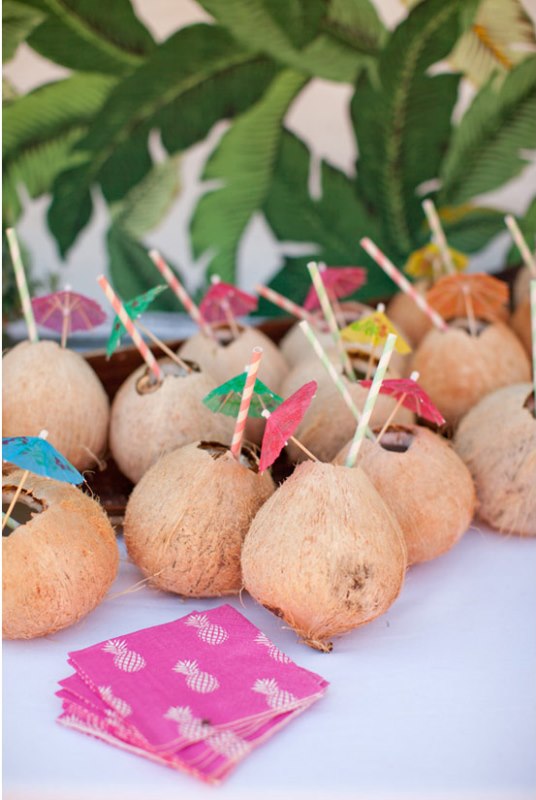 coconuts as cocktail glasses and colorful umbrellas will make your gals feel in tropics