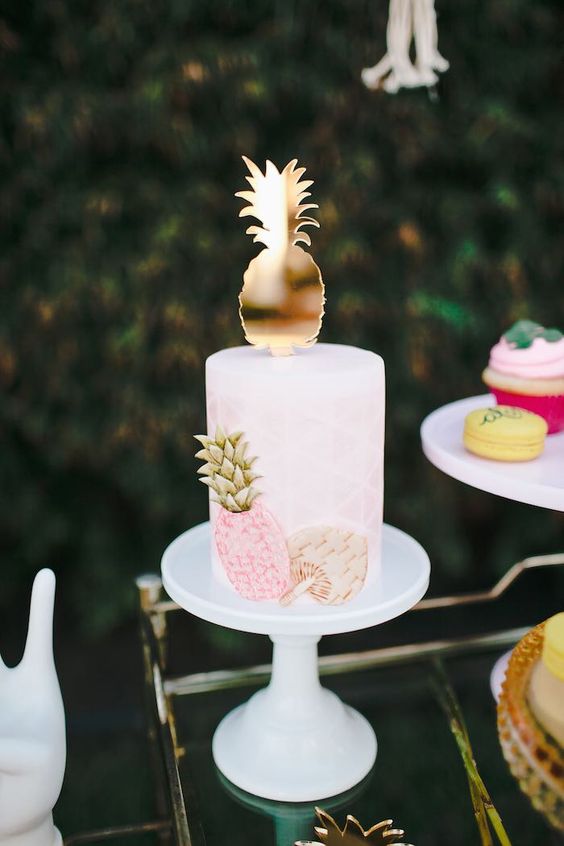 a tropical bridal shower cake in blush, with a sugar pineapple and fan plus a pineapple topper